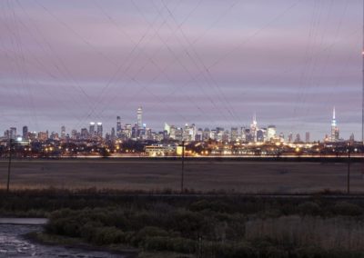 An evening view of the New York City skyline as seen from The Station at Lyndhurst Apartments.